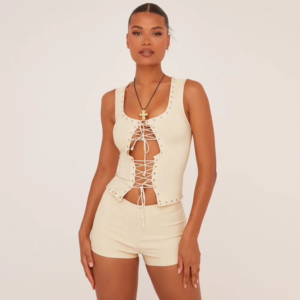 Sleeveless Eyelet Detail Tie Front Top In Stone Woven & Low Rise Booty Shorts SET