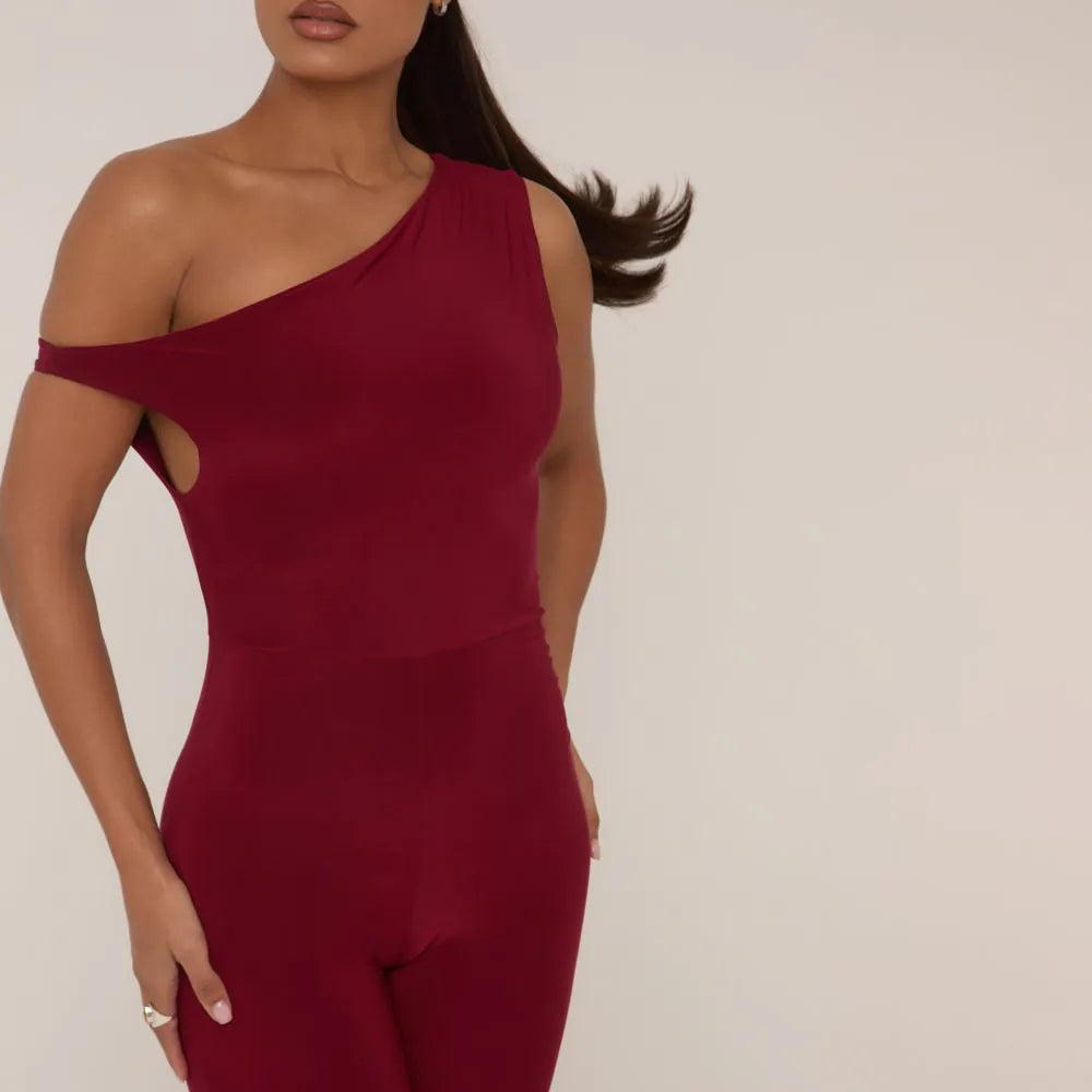 Asymmetric Shoulder Flared Jumpsuit In Burgundy Slinky