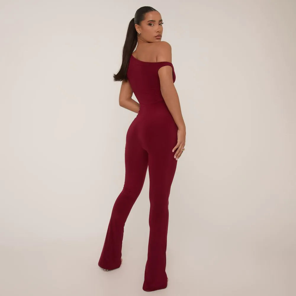 Asymmetric Shoulder Flared Jumpsuit In Burgundy Slinky