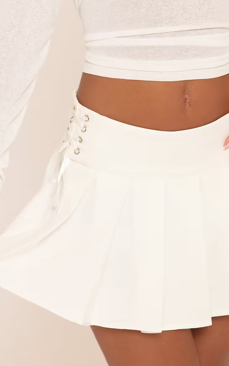 Ego - Mid Rise Lace Up Side Pleated Mini Skirt In White