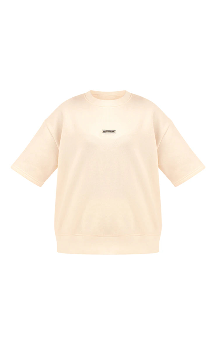 CREAM BADGE DETAIL OVERSIZED SHORT SLEEVE SWEATSHIRT