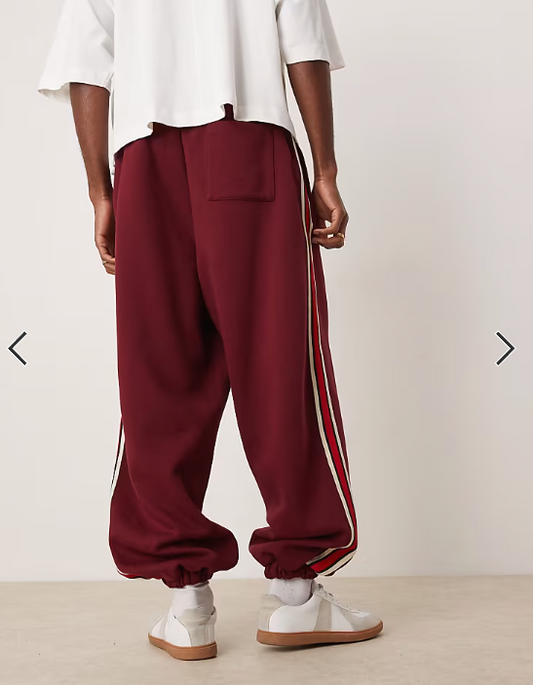 ASOS DESIGN baggy balloon jogger with taping in burgundy