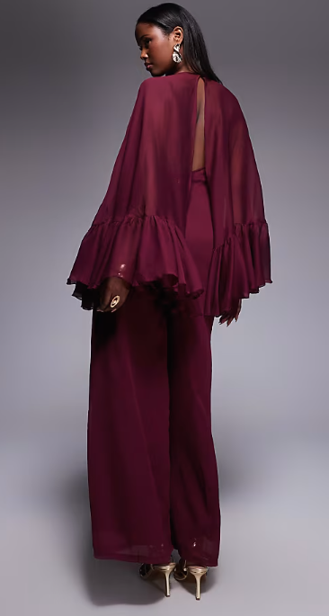 ASOS DESIGN volume ruffle cape jumpsuit in berry