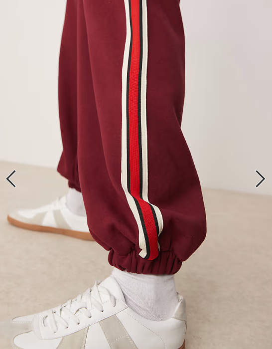 ASOS DESIGN baggy balloon jogger with taping in burgundy