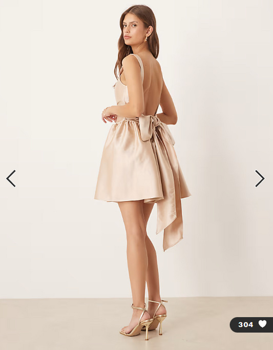 Six Stories drop hem bow back mini dress in soft gold