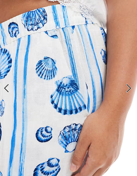 Vero Moda Curve wide leg trousers in blue seashell print