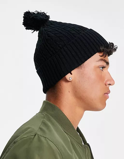 Bobble beanie in black cable knit