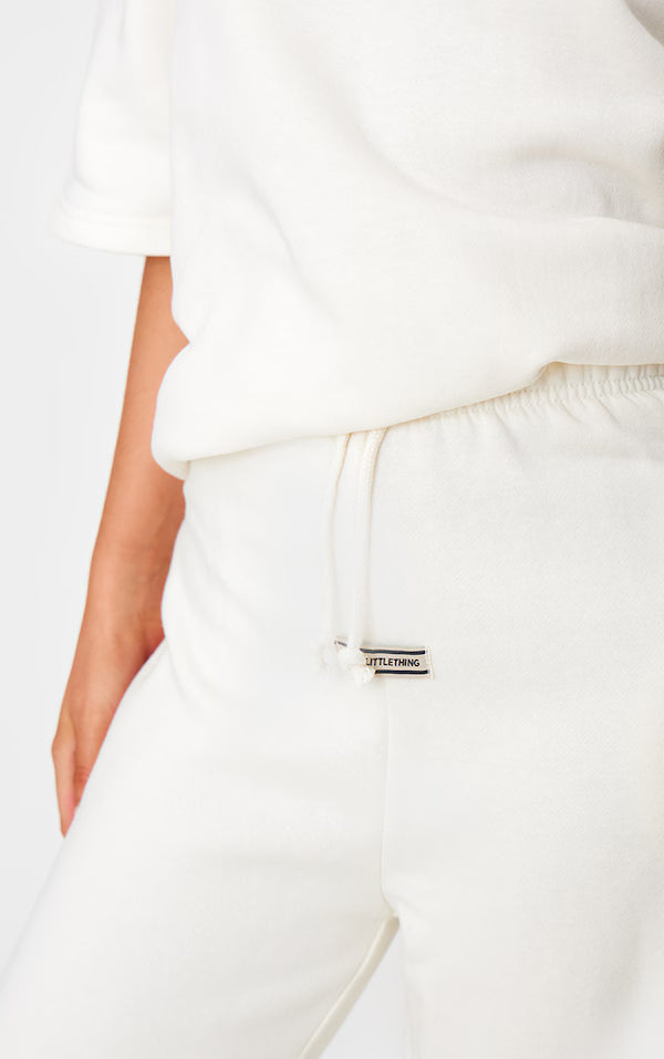 Cream Badge Detail Mid Rise Wide Leg Joggers