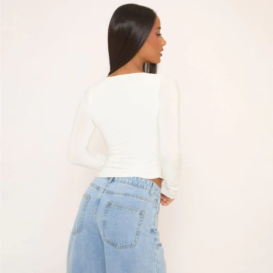 Long Sleeve Asymmetric Hem Top In White Slinky