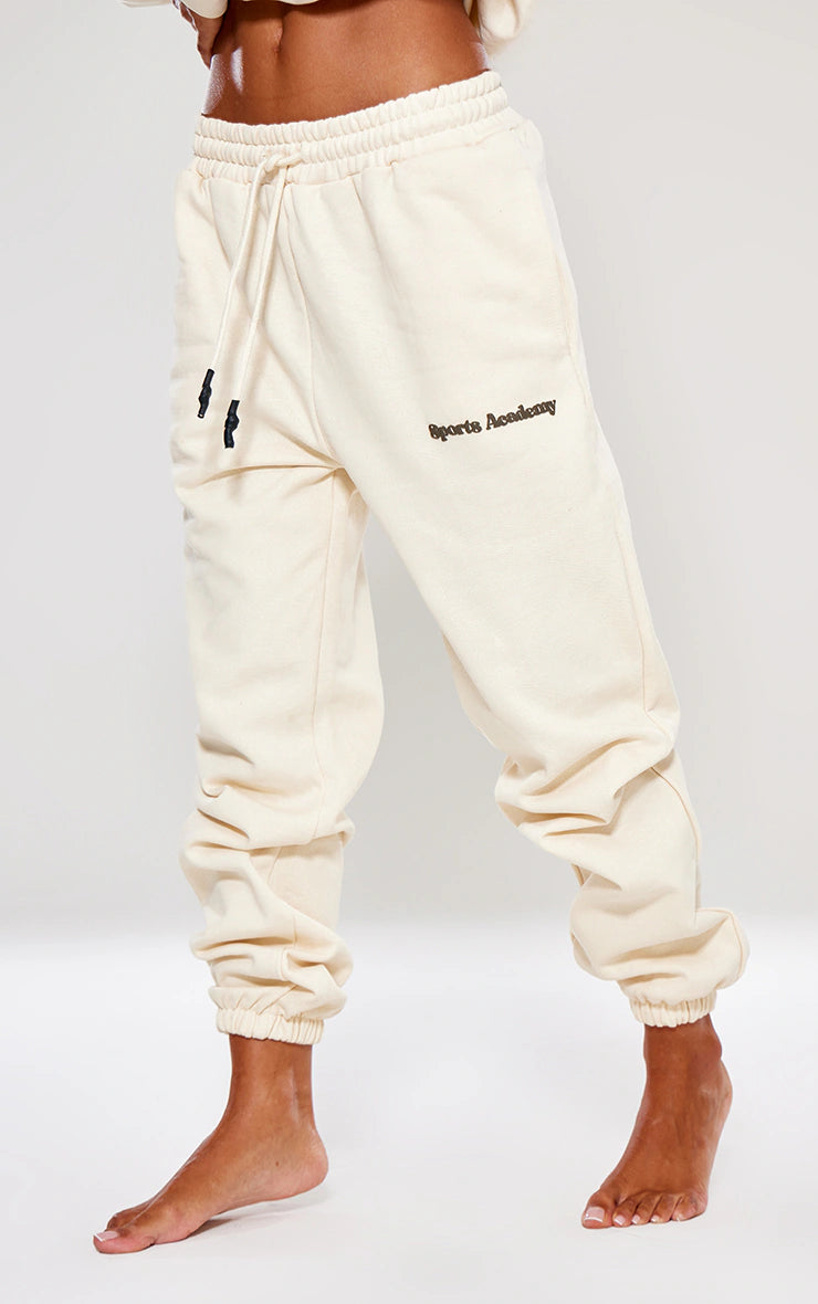 PREMIUM SAND SPORTS ACADEMY PUFF PRINT OVERSIZED JOGGERS