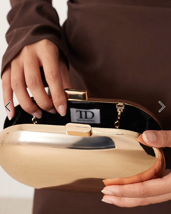 True Decadence oval hard clutch bag in gold