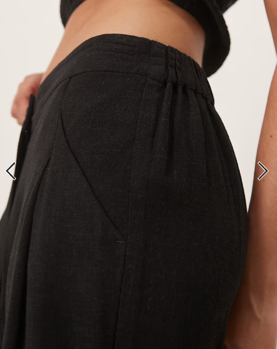 ASOS DESIGN pleat front tapered pants with linen in black