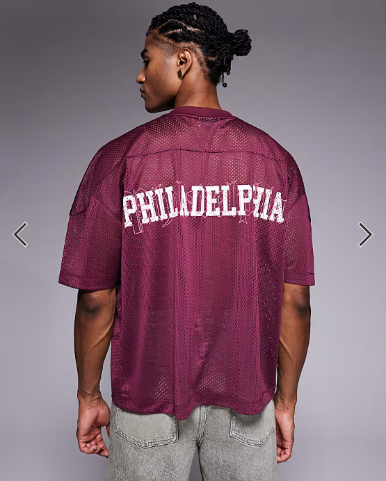 ASOS DESIGN boxy oversized T-shirt with dropped shoulder and v neck with sports graphic in burgundy airtex .