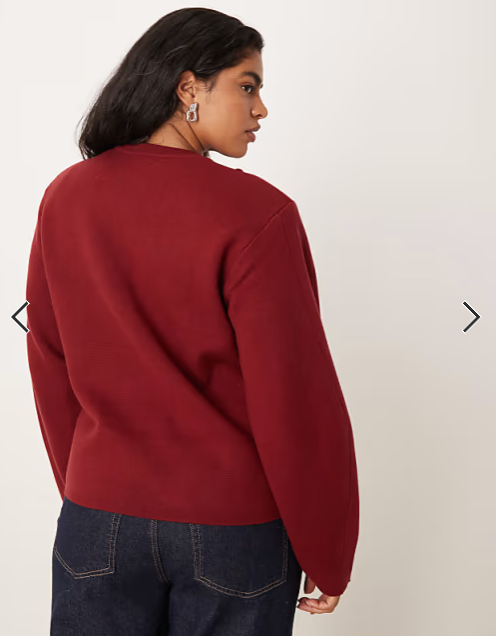 ASOS DESIGN Curve structured waisted jumper with shoulder pads in burgundy