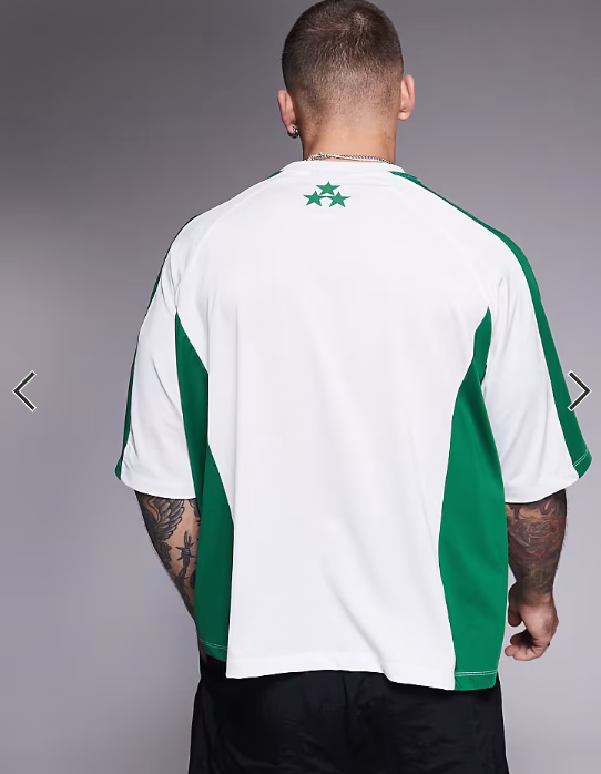 ASOS DESIGN boxy oversized t-shirt with panelling and text graphic in white sports fabric .