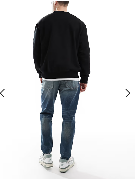 ASOS DESIGN tapered jeans with vintage tint in dark wash blue