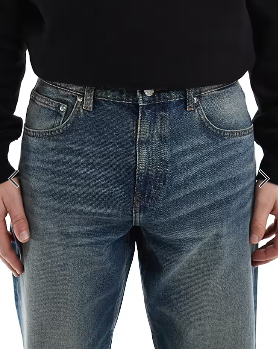 ASOS DESIGN tapered jeans with vintage tint in dark wash blue