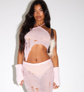 Baby pink distressed open knit dipped hem top