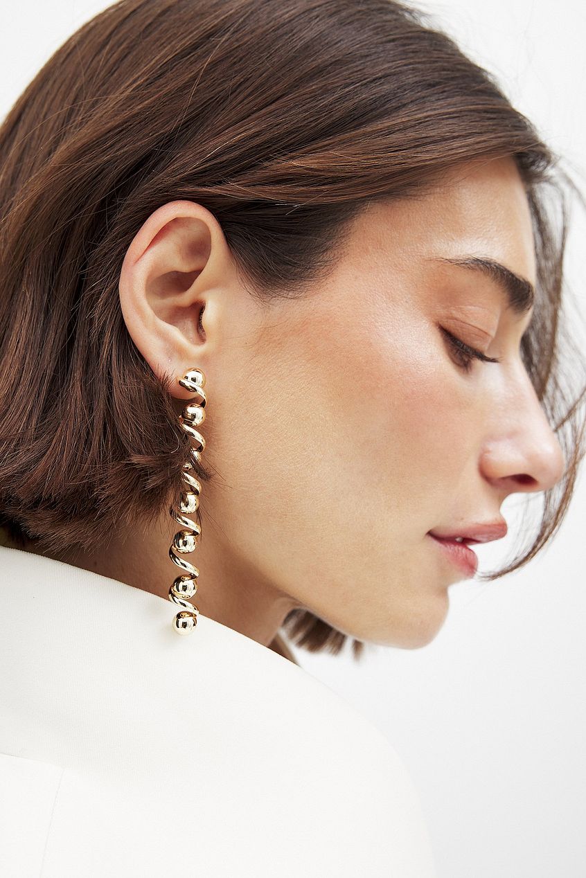 Na-kd Long Swirl Earrings
